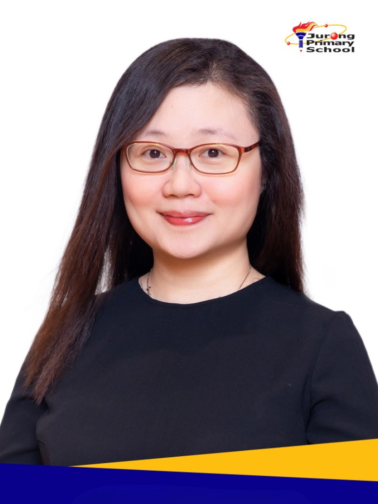 Smiling woman in black top, long dark hair, brown-framed glasses